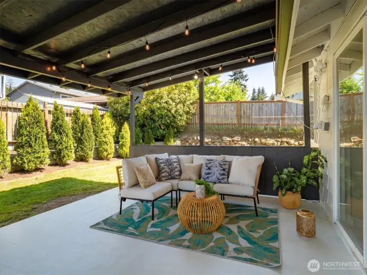 Covered patio extends living space outdoors, ideal for relaxing or entertaining. Image from earlier listing in Sep 2025.