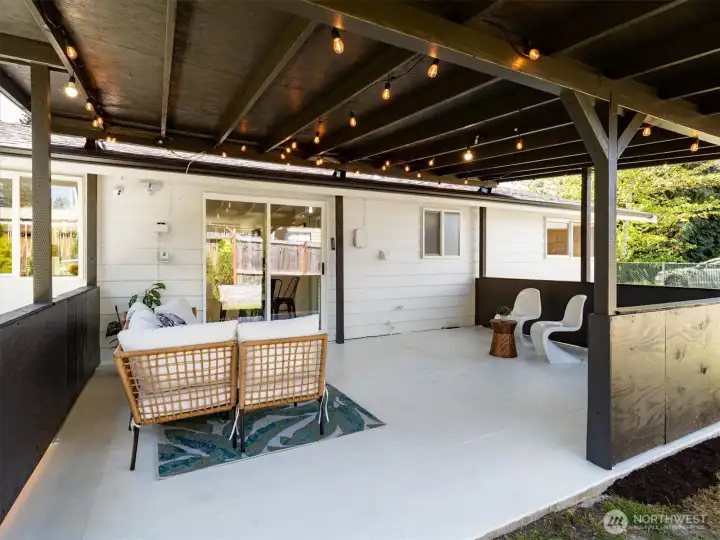 Covered patio extends living space outdoors, ideal for relaxing or entertaining. Image from earlier listing in Sep 2025.