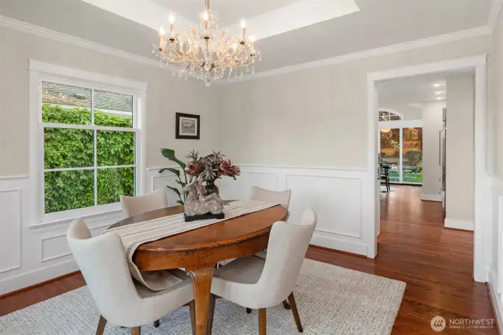 Formal dining room featuring a 1930s-era crystal chandelier by Massive