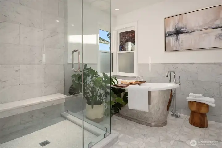 Primary Bedroom on this level is a spacious retreat with all the amenities needed for a relaxing and rejuvenating atmosphere.  Make life simple with lighted closet organizers. In-spa bath with glass enclosed steam shower, free standing bathtub, heated floors and towel rack, dual sinks and plenty of cabinet space. High quality Kohler fixtures, mosaic marble, pewter sconces, hand rubbed antique brass, dual Robern medicine cabinets.