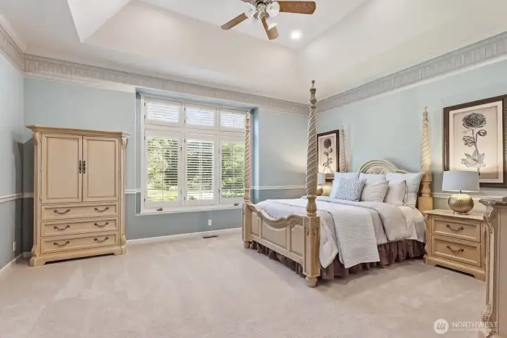 At the other end of the home you’ll find the 4 bedrooms and 3 bathrooms. The spacious primary suite boasts tall coved ceilings with crown molding.