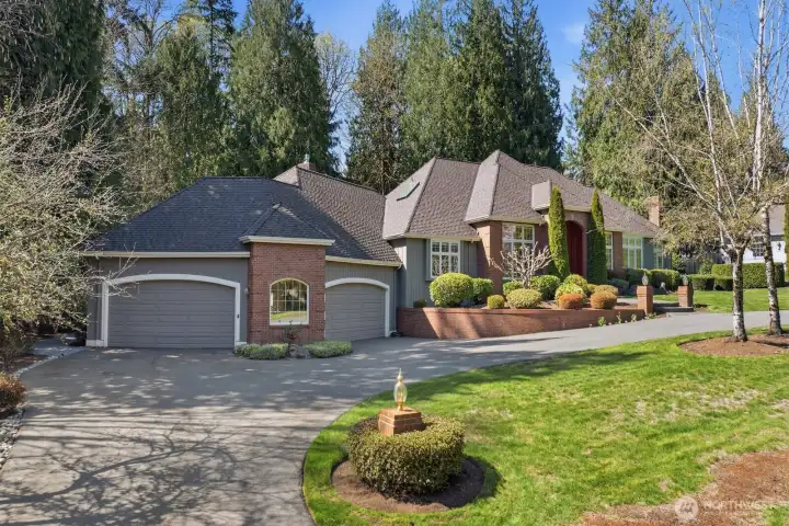 Circular driveway, impressive front entrance and 4 car garage.