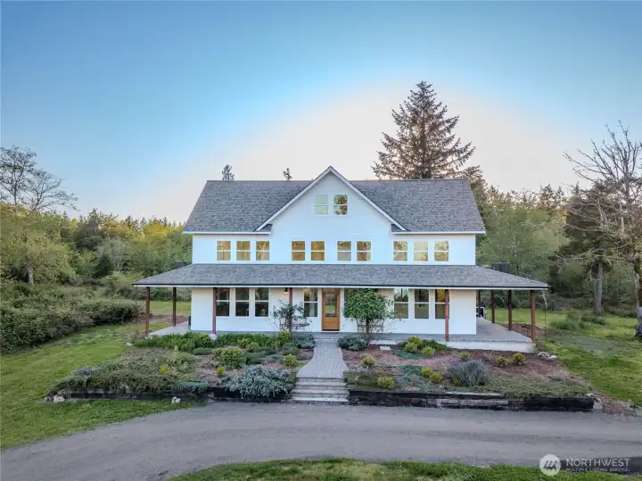 Main farmhouse faces east to bay views with sunsets aft.