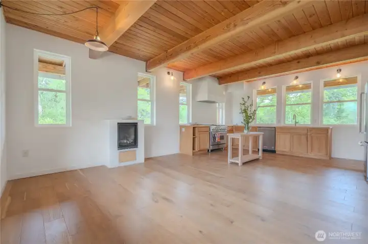 Light-filled farmhouse kitchen centered around simplicity and functionality. Thoughtful details feature butcher block countertops and gas range offer immediate livability with room to personalize over time.