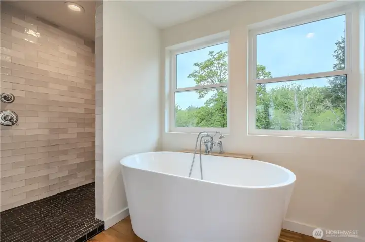 Intentionaly open spa inspired layout integrates the soaking tub into the bedroom sanctuary creating a calming experience. The layout readily accommodates barn door or privacy screen alterations if preferred