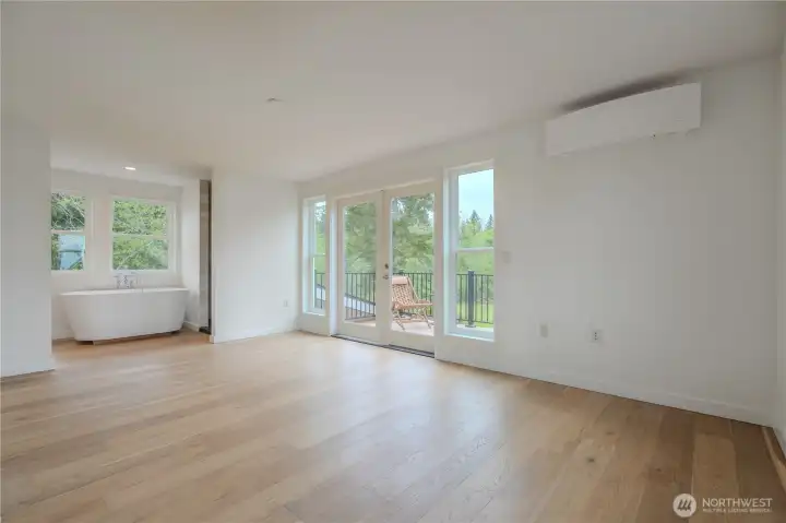 North primary suite with walk out deck