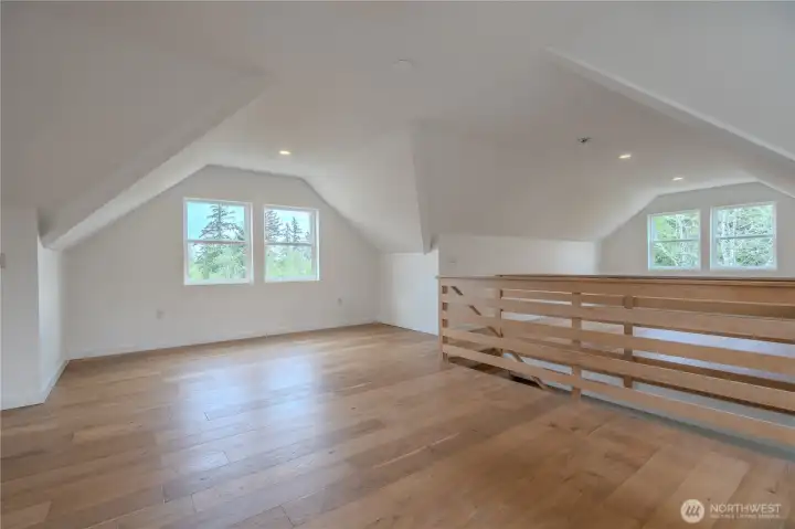 Bonus room is split by stair access