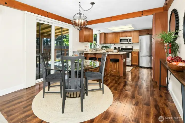 Dining room with slider to covered Trex deck.