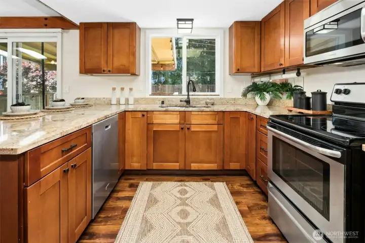 Enjoy granite countertops and stainless steel appliance suite.