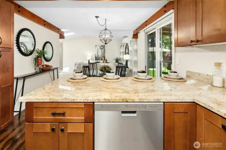 View from kitchen into dining room. Additional storage pantry to your left.