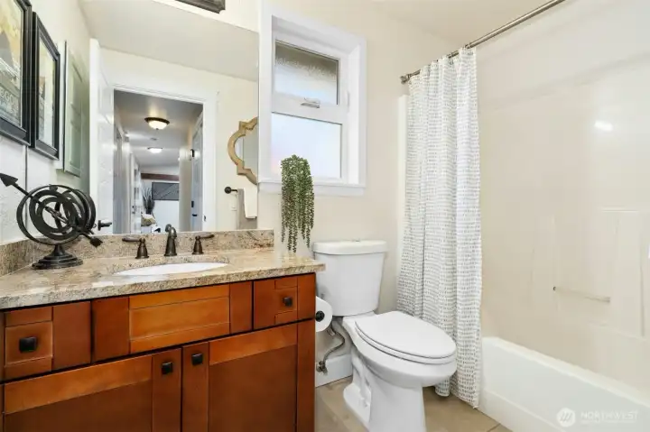 Full bathroom located at the end of the hallway.