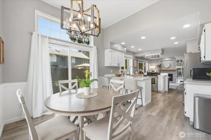Dining area as well as casual bar seating in this beautiful chef's kitchen!