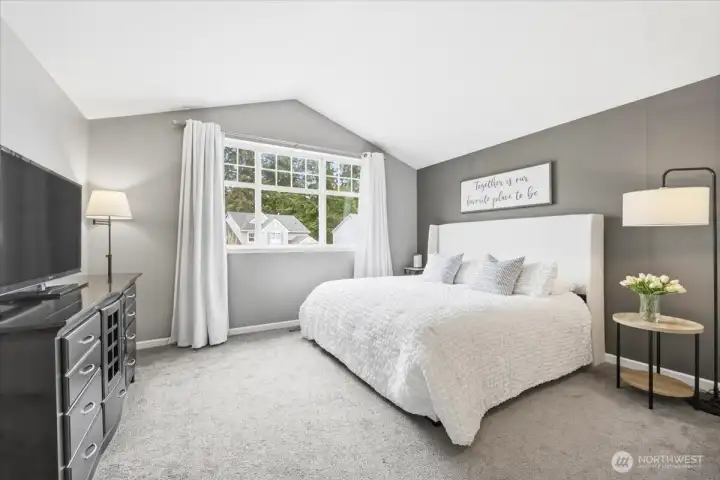 Spacious primary retreat with light pouring in from west-facing windows!