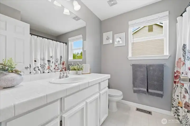 Tasteful updates in this beautiful full bath!