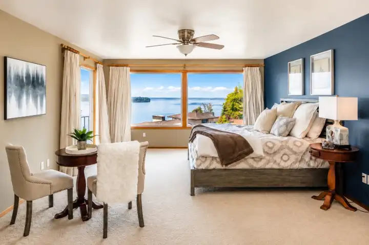 Primary bedroom with sweeping views and balcony.
