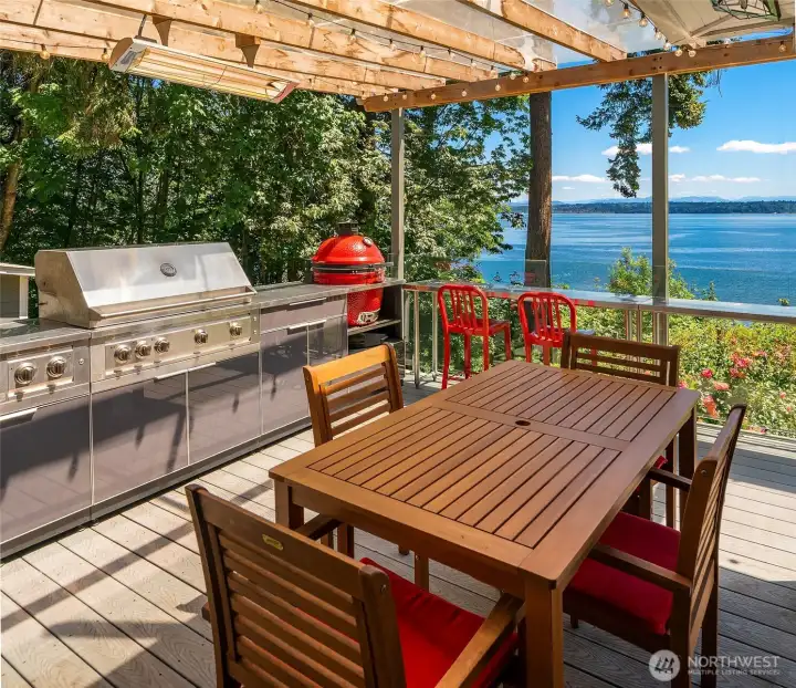 Outdoor kitchen on the covered deck for three season entertaining. Outdoor kitchen on the covered deck for three season entertaining.