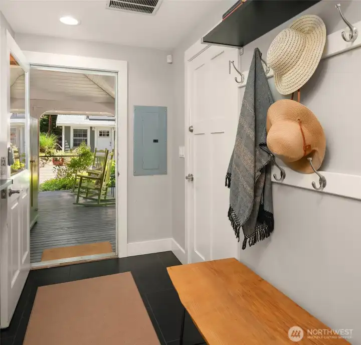 Side entrance mudroom with large closet. Side entrance mudroom with large closet.