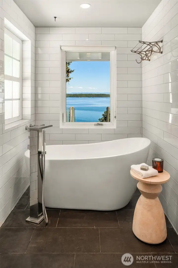 ... includes a walk-in shower and modern soaking tub - with a view. ... includes a walk-in shower and modern soaking tub - with a view.