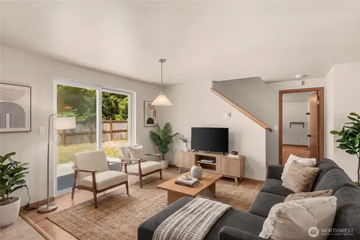 Here is the family room off the kitchen, with a big slider out to the fenced backyard....Virtually staged. Here is the family room off the kitchen, with a big slider out to the fenced backyard....Virtually staged.