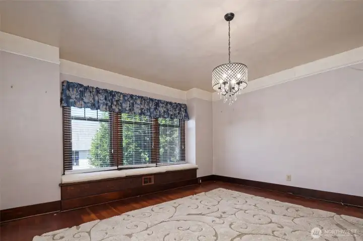 Dining room with built-in window seats with storage.