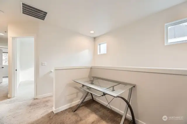 The upstairs nook makes a great place for a desk or reading chair