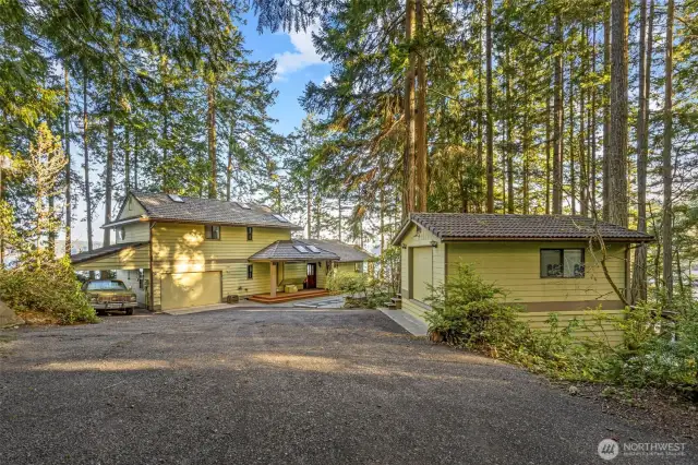 Nestled amongst stately firs, the property is private, but dappled with natural light.