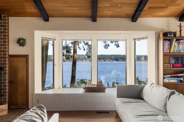 Vaulted ceilings with exposed beams and handsome tongue in groove cedar.