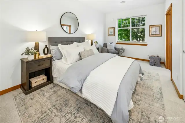 The main-floor primary suite offers the convenience of an en-suite bath and easy access to everyday living. Ideal for those seeking main-level living with the flexibility of additional space upstairs for guests or a home office. The main level features the primary bedroom and bath, a well-appointed kitchen, comfortable living room, powder bath with laundry, and direct access to the private two-car garage.