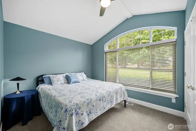 The inviting colors of this bedroom serve as a perfect retreat for rest and rejuvenation. In addition to it's beautiful aesthetics, it offers plenty of room for this king-sized bed, and features a stylish double door closet thats not only practical, but also adds an element of elegance to the rooms overall design.