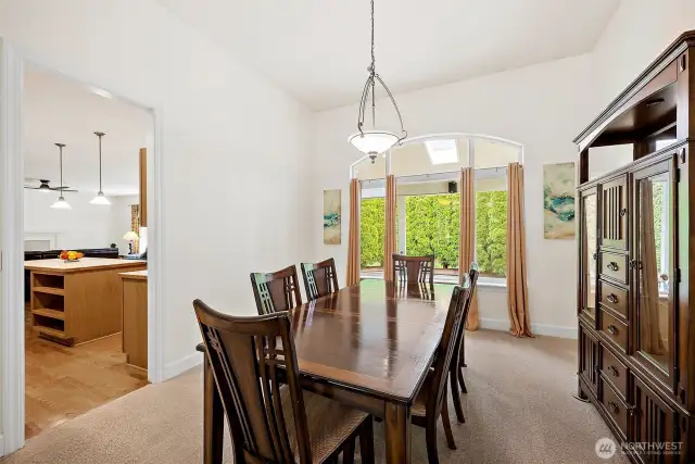 Formal dining room featuring expansive windows that provide a view of the covered back deck and surrounding landscape