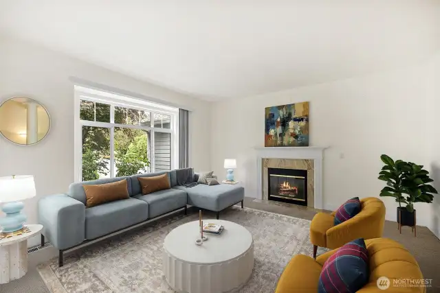 Formal living room thoughtfully designed offering a perfect blend of of comfort and style, with gas fireplace and large windows that frame lovely views of your front landscape (this room is virtually staged)