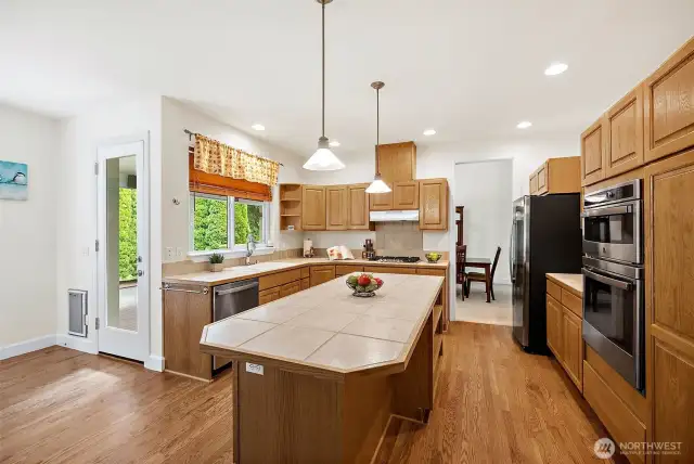 The large island not only provides additional prep space, but also serves as a cozy spot for casual meals and entertaining.