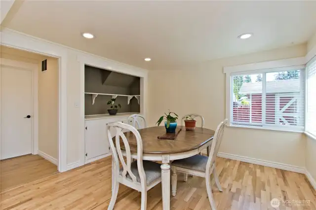 Dining area features a  special built in space for storage or display