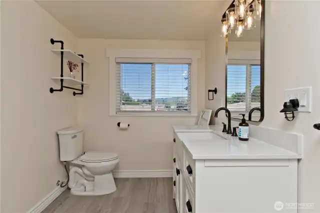 Upstairs features newly remodeled full bathroom.