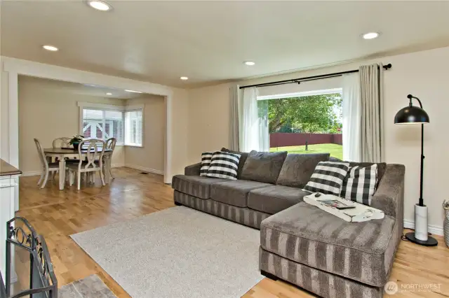 The large living room flows into the formal dining area.