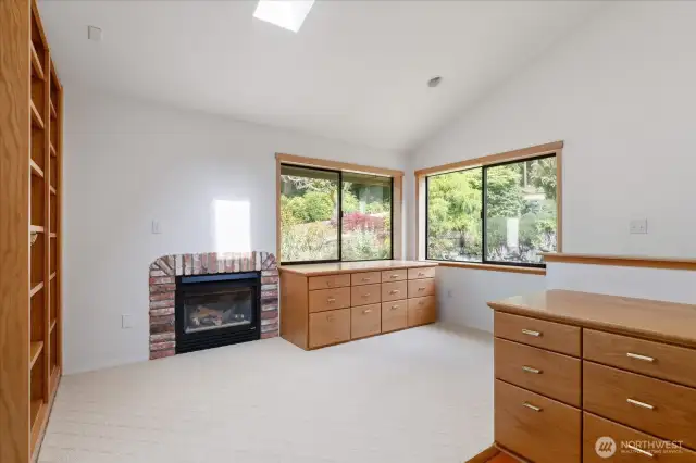 Office with beautiful built in cabinetry and natural gase fireplace