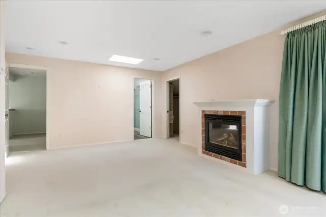 Primary bedroom with natural gas fireplace