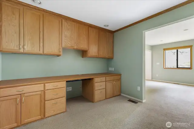 Studio area off bonus room with custom built in cabintry