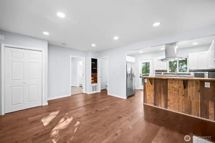Entry coat closet, primary bedroom, powder room.