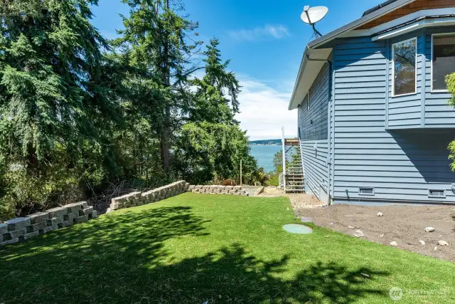 Extensive stone work along with the turf on multiple levels of the yard.