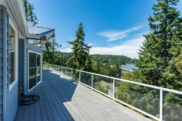 Composite decks on both levels and glass enclosure to block wind and allow see through visibility. The perfect place to enjoy and relax with this fantastic view.