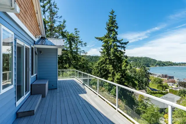 Door from the primary main floor suite steps out to the deck as well.