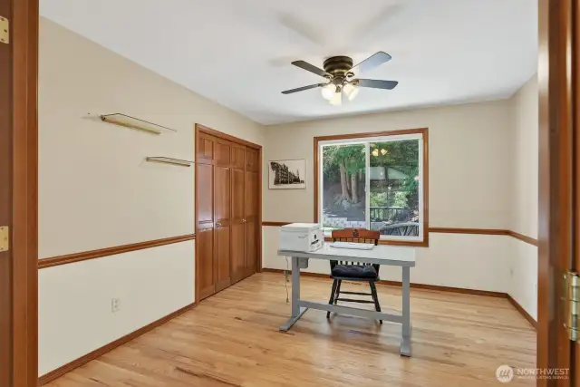 Large den/office with French doors on the main floor with a big closet.
