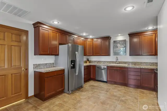 Full size kitchnen with stainless appliances.