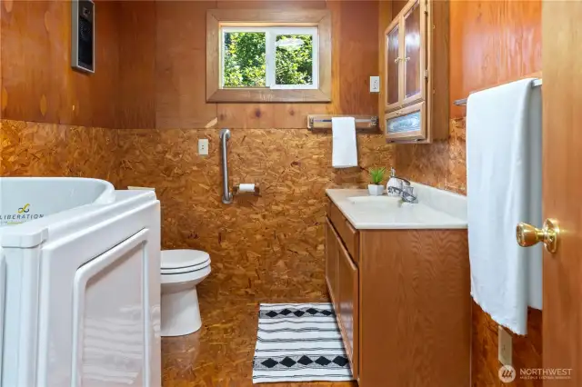 Hall bathroom with an accessible tub