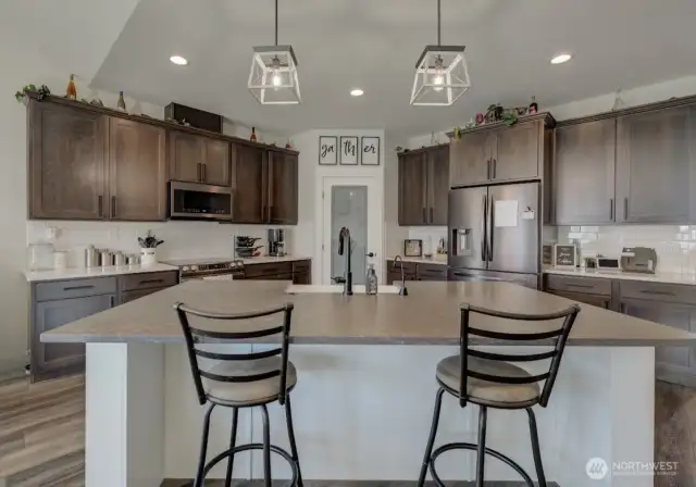 Expansive kitchen island offers seating and a perfect gathering space.