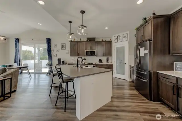 Gourmet chef’s kitchen boasting an oversized island and sleek quartz finishes