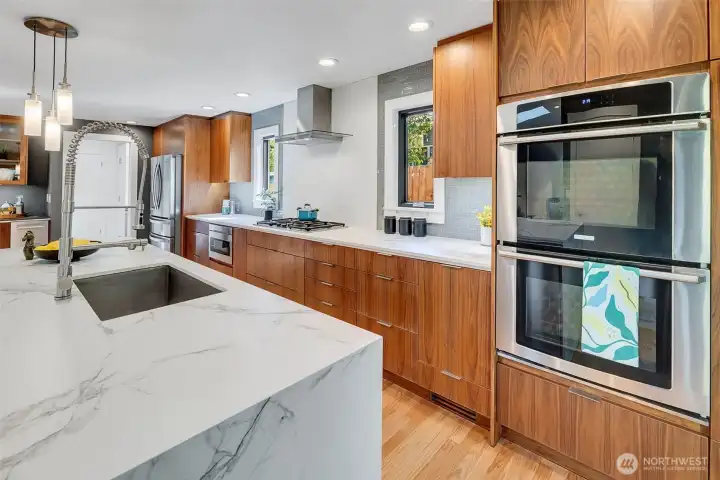 The cabinet to the left of the oven has a custom pull-out feature for a stand mixer.