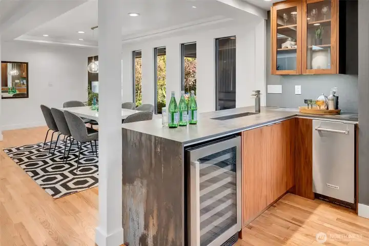 The bar area has a wine refrigerator and a built-in ice machine, plus a prep sink that doubles as a beverage ice bucket! How cool is that?