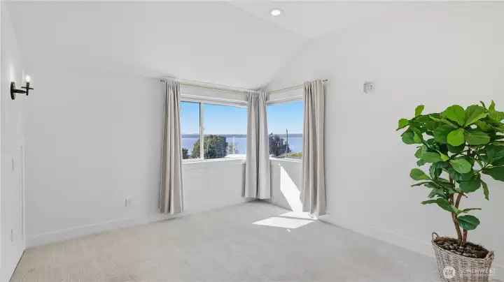 Bedroom windows bring in abundant natural light and mesmerizing views.